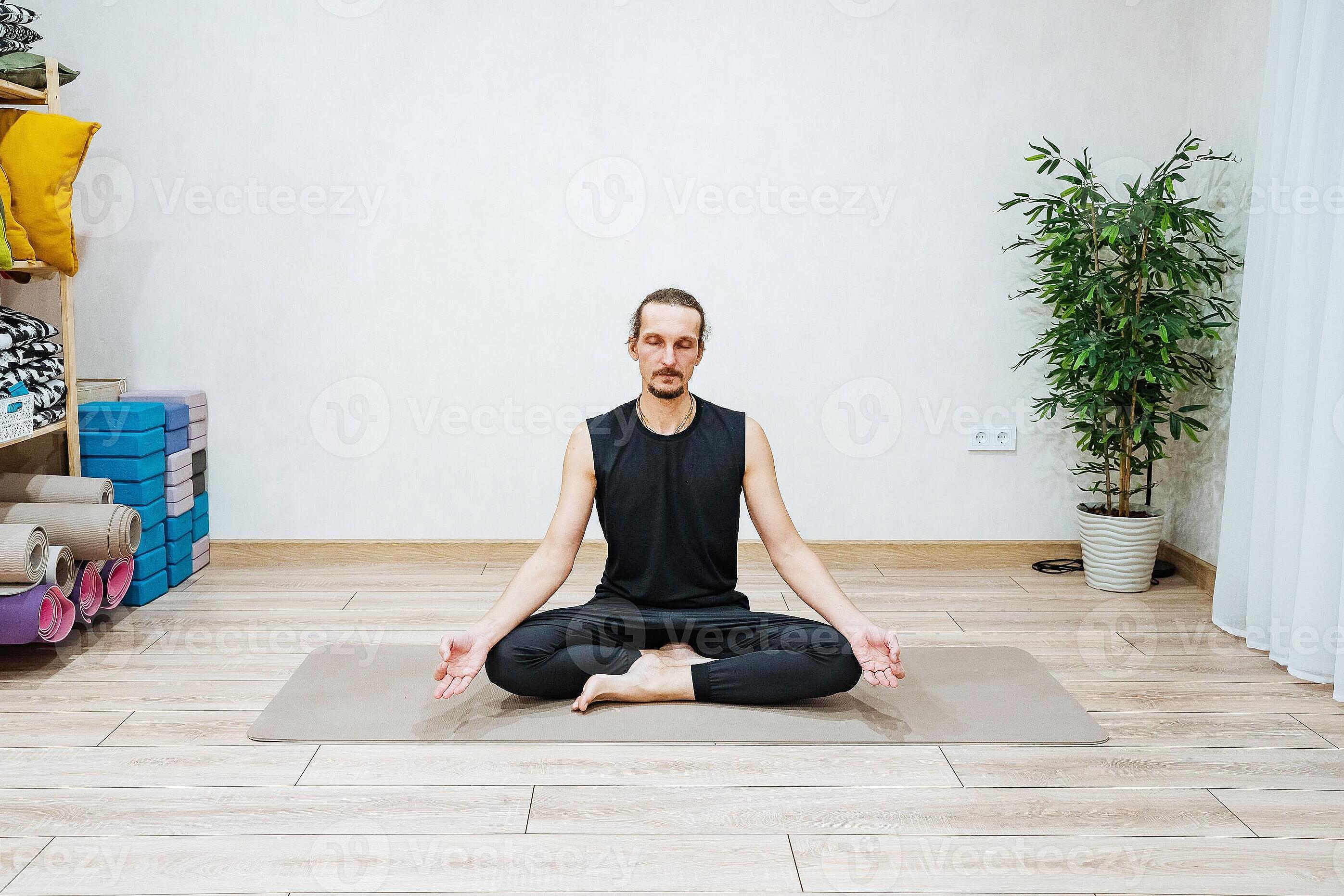 Individual practicing deep breathing exercises in peaceful home environment
