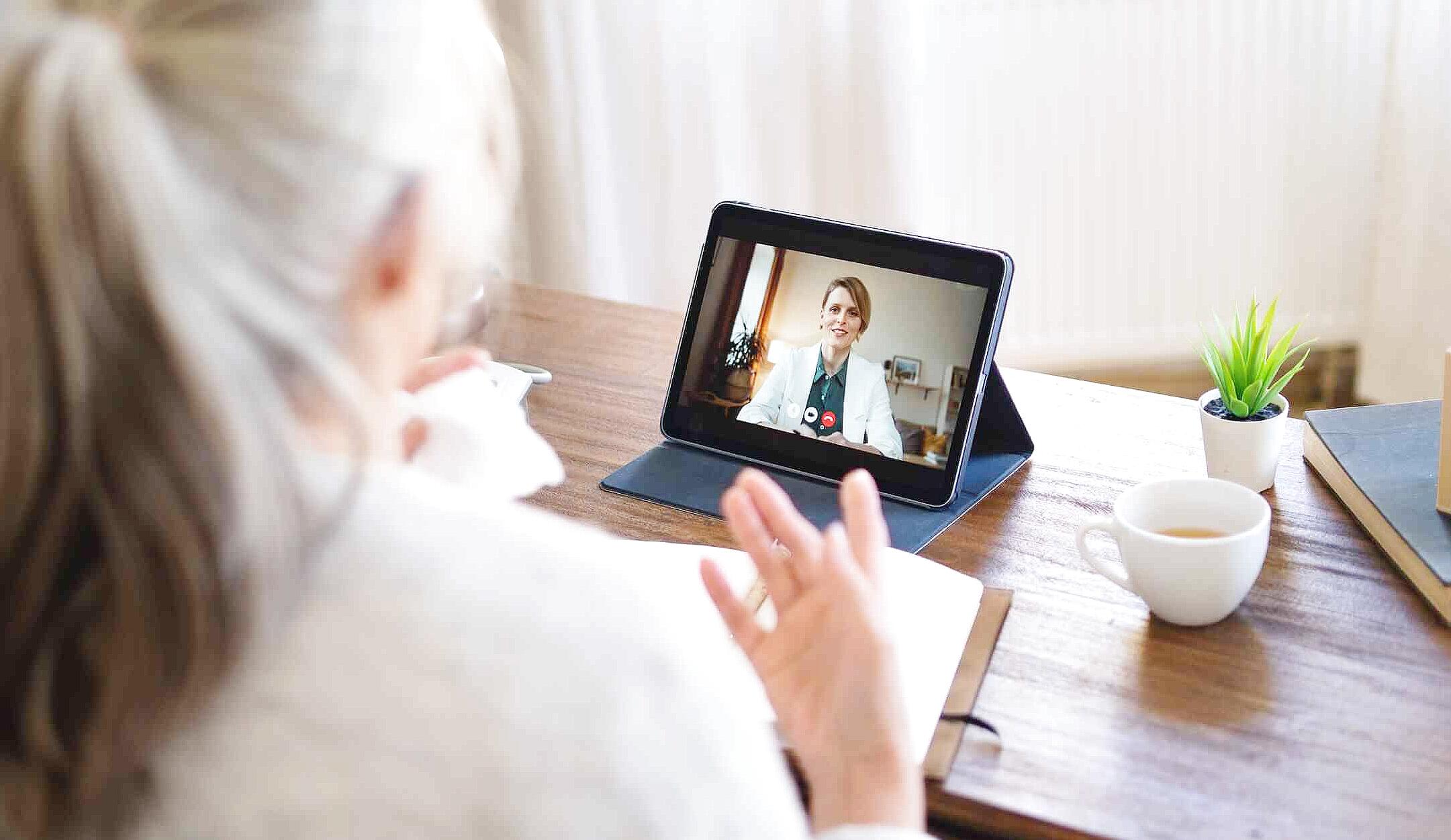 Adult connecting with licensed online therapist via video call