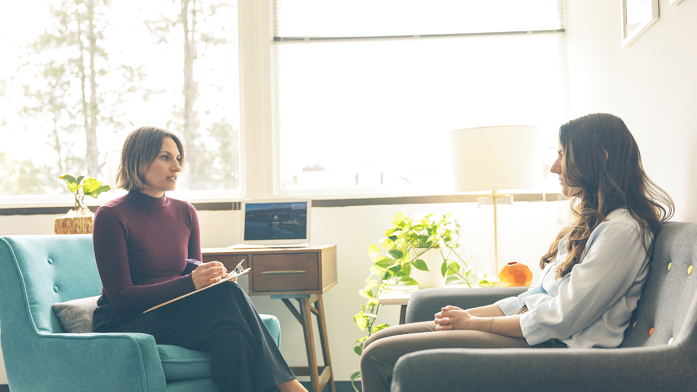 User engaging with an ERP OCD management app on smartphone at home in evening