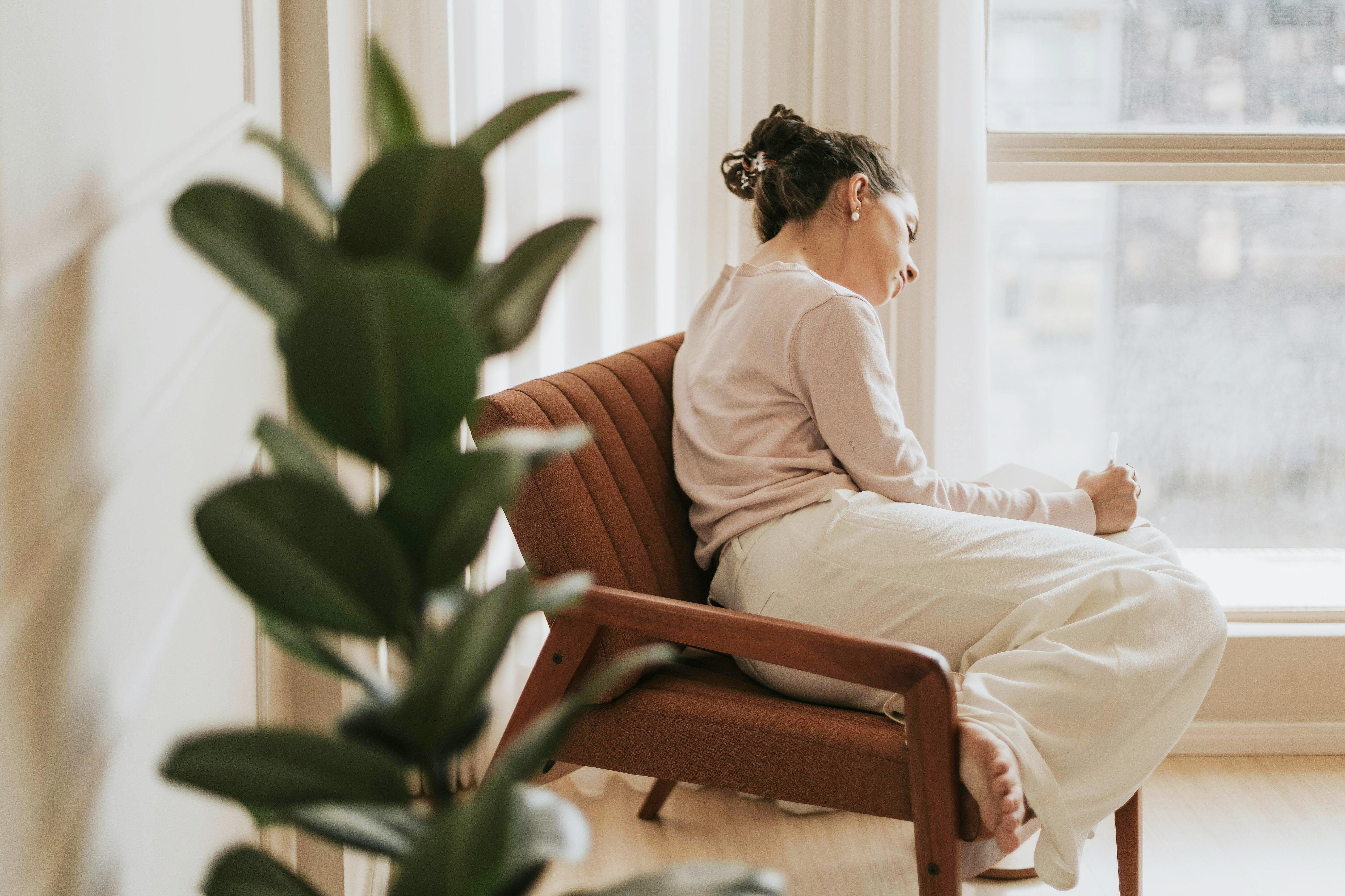 person reflecting on mental health feelings at home
