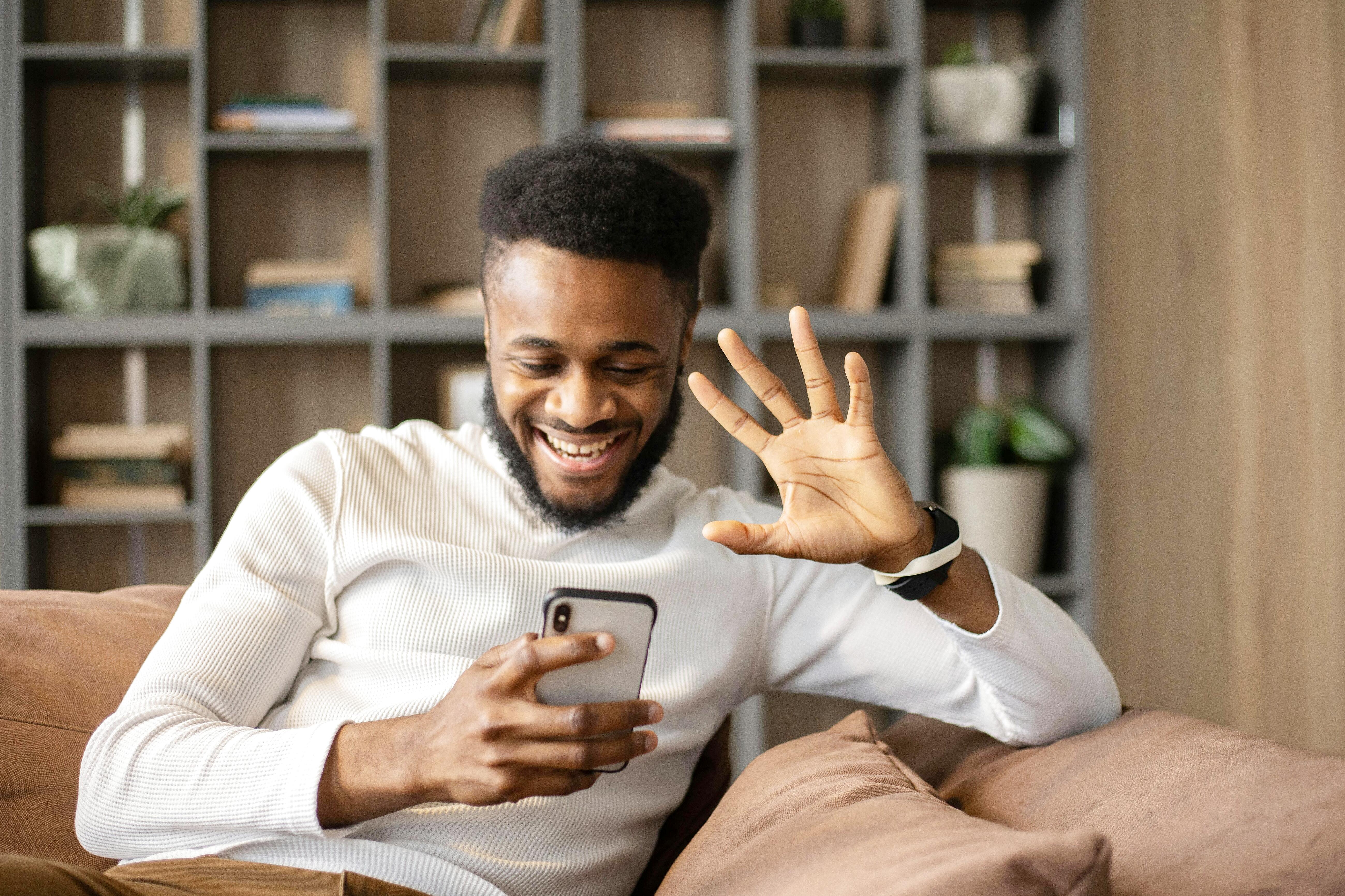 Individual in a comfortable setting during online therapy session