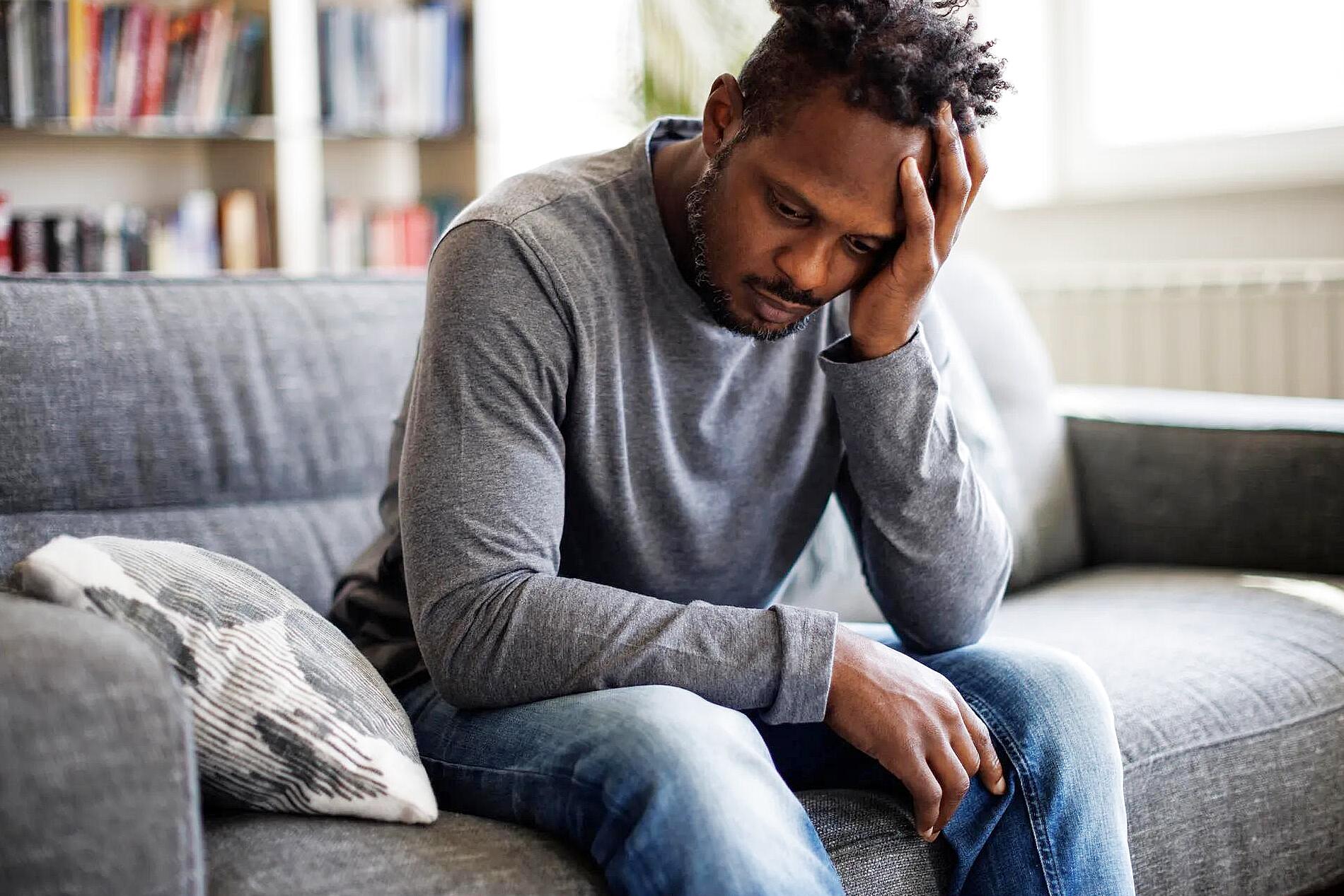 Person showing visible sadness and emotional numbness contrasting emotions