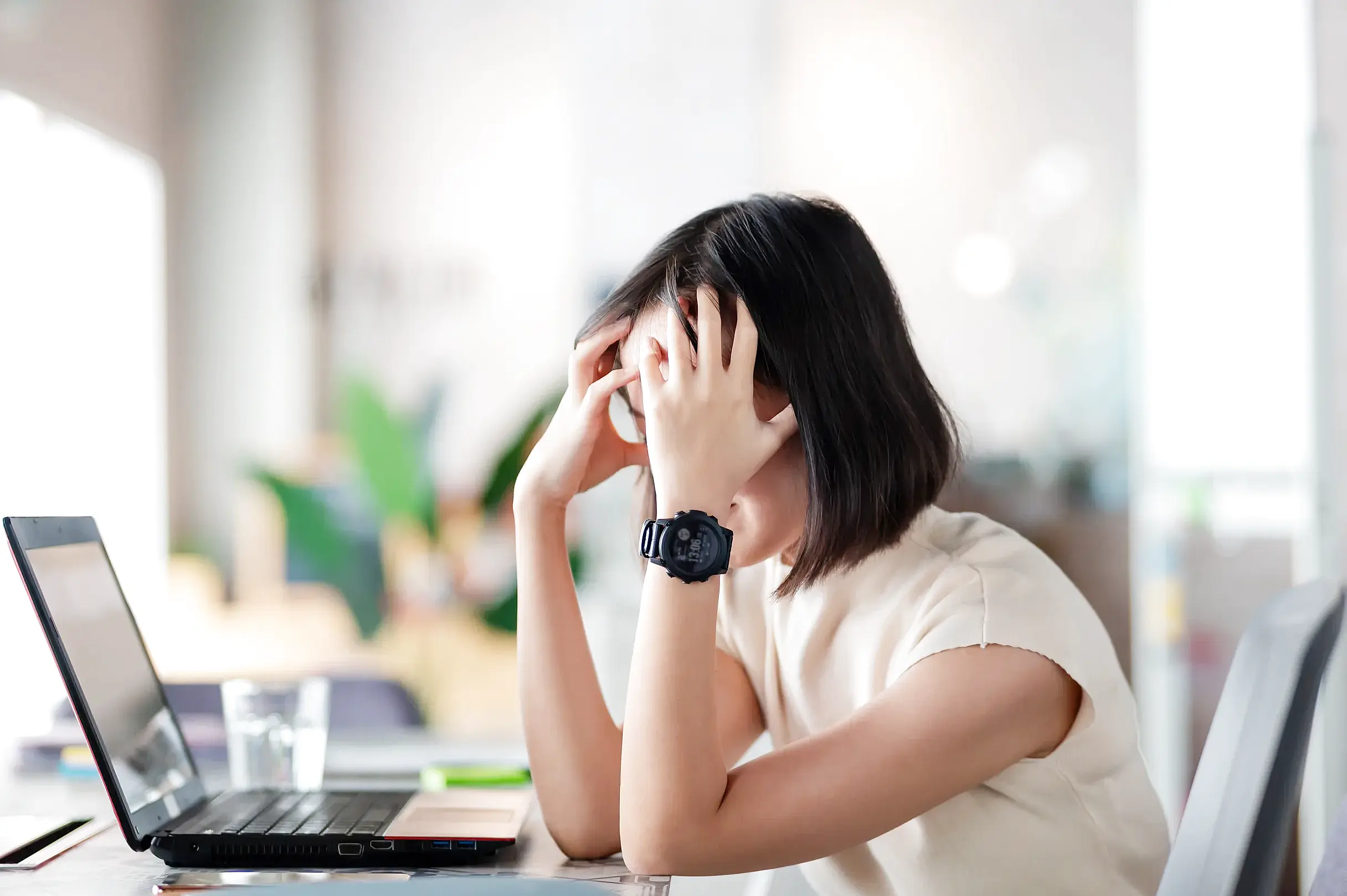 Young professional exhibiting signs of emotional numbness and irritability