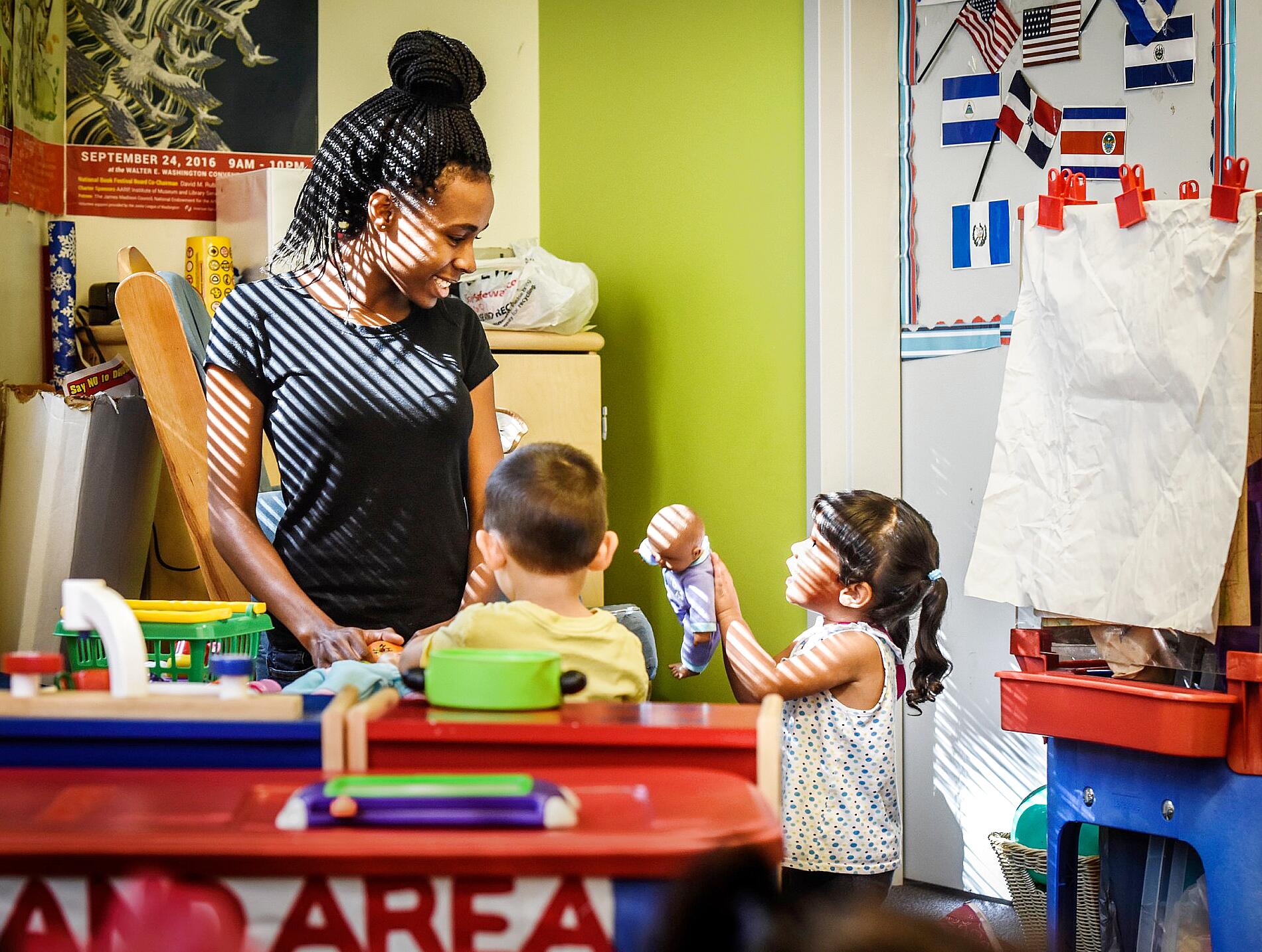 Working parent using laptop to explore flexible childcare options at home