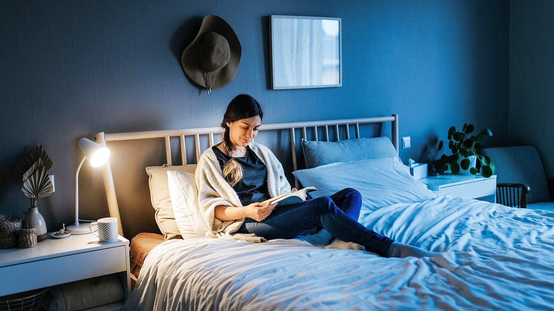 Person combining small micro-habits into evening routine for better sleep